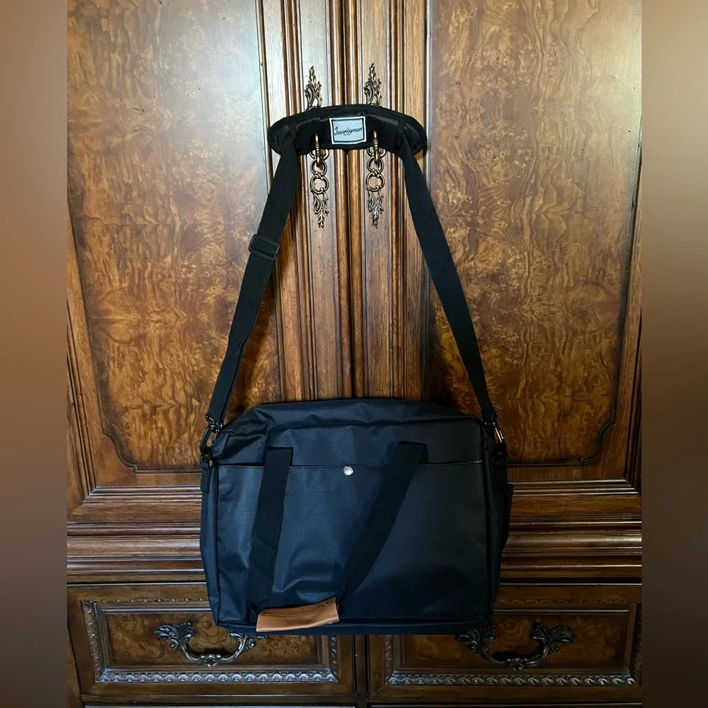 NWT The Journeyman Bag Co Duffle Bag in black with red mesh interior.